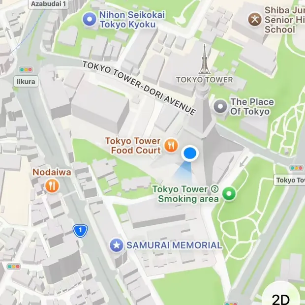 Apple Maps on a test iPhone, with the map centred on Tokyo Tower and a blue location marker on the tower